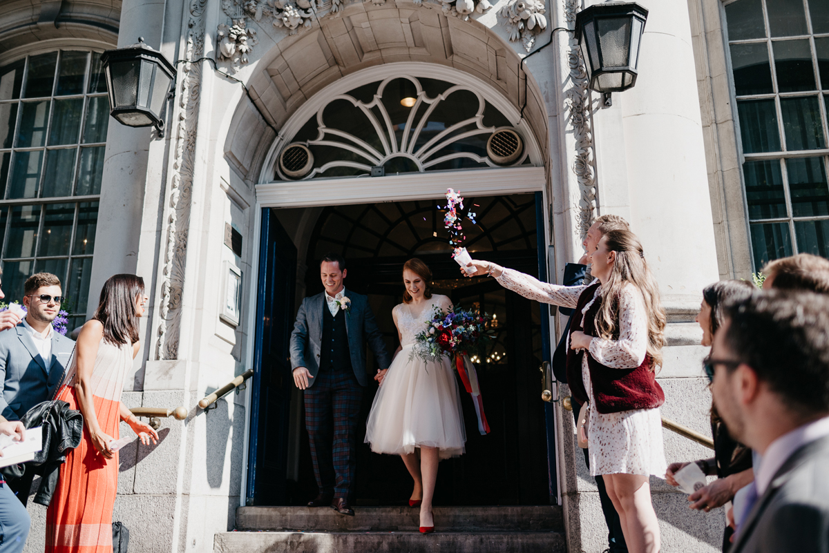 Short tulle skirt red shoes chic London family wedding Elaine Williams Photography 24