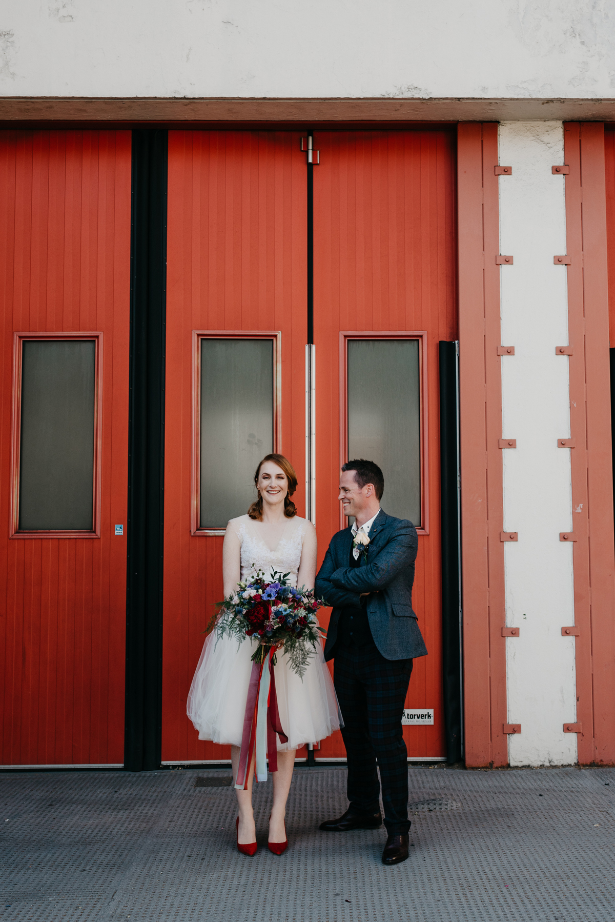 Short tulle skirt red shoes chic London family wedding Elaine Williams Photography 35