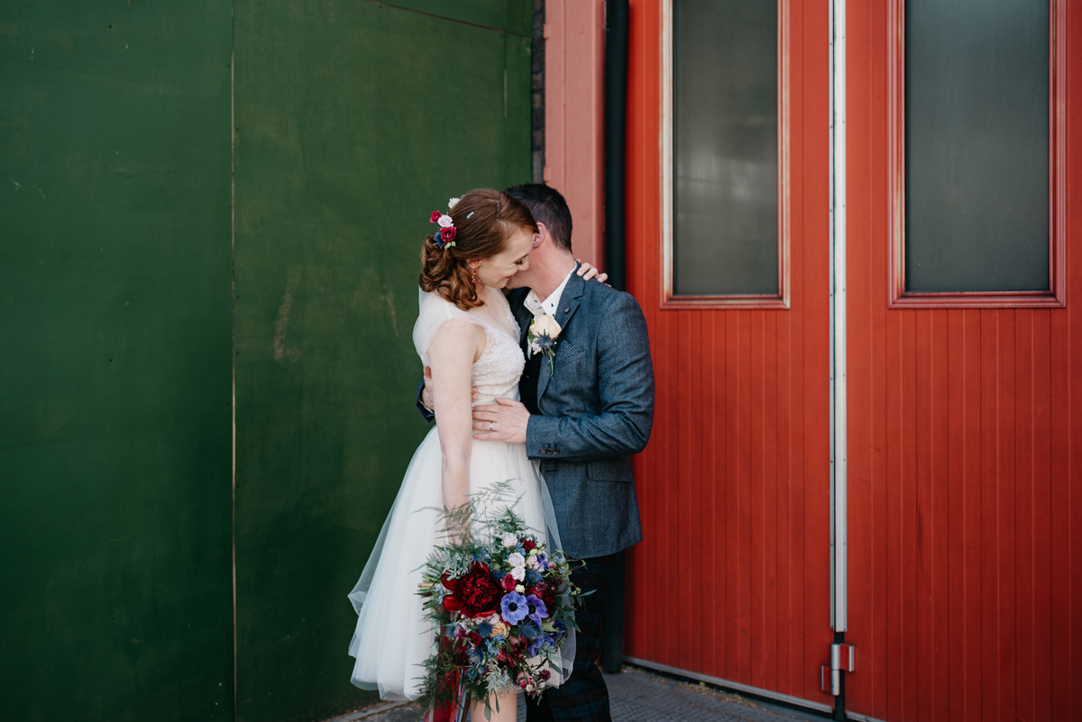 Short tulle skirt red shoes chic London family wedding Elaine Williams Photography 37