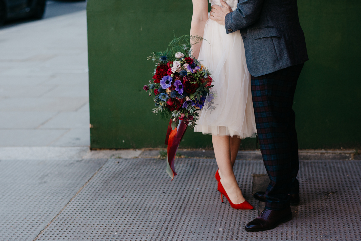 Short tulle skirt red shoes chic London family wedding Elaine Williams Photography 38