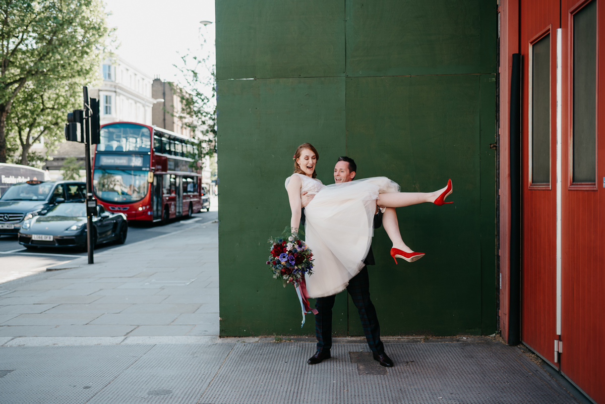 Short tulle skirt red shoes chic London family wedding Elaine Williams Photography 39