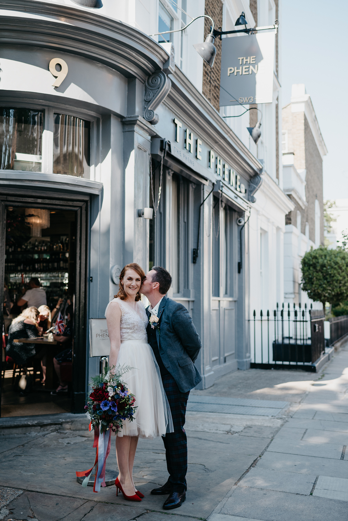 Short tulle skirt red shoes chic London family wedding Elaine Williams Photography 43