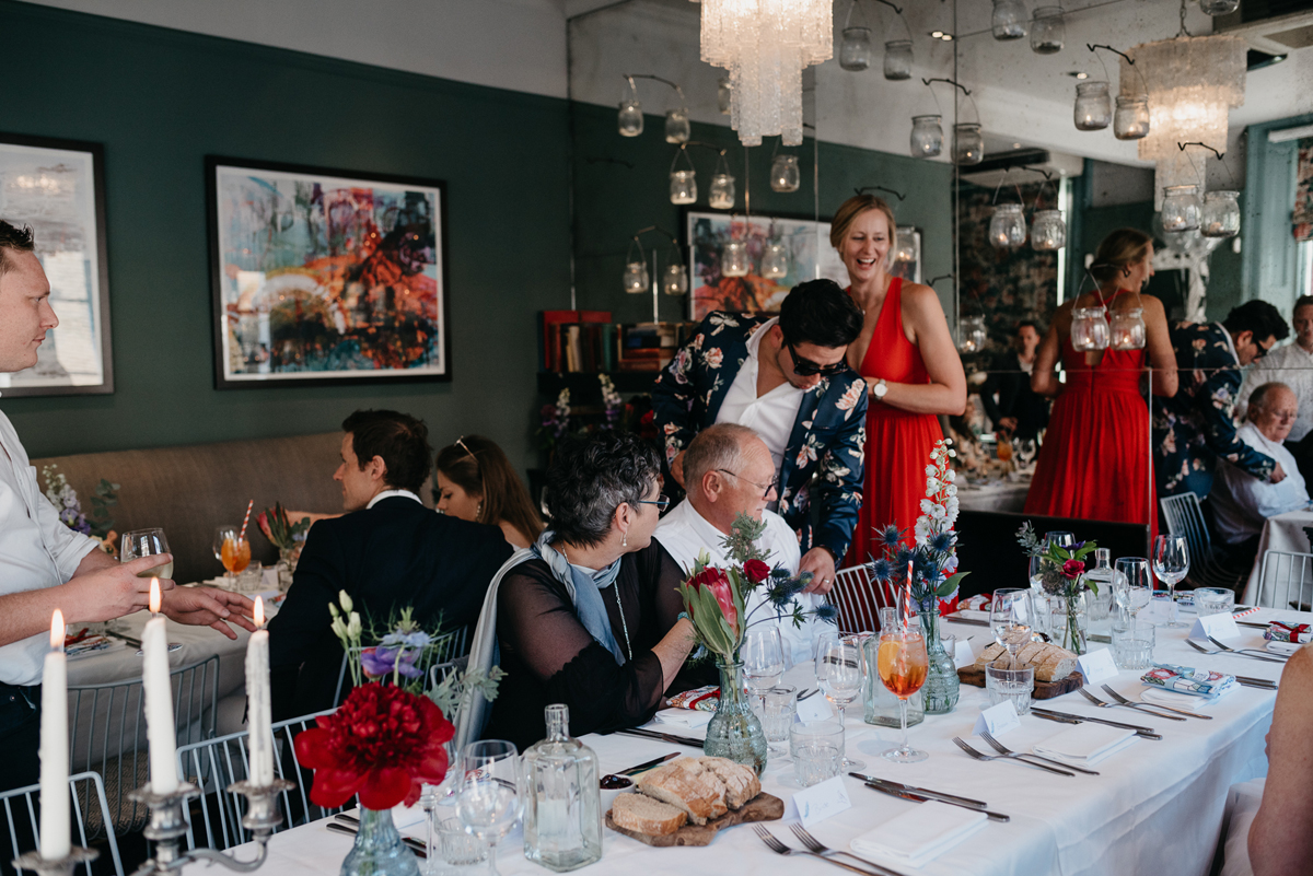 Short tulle skirt red shoes chic London family wedding Elaine Williams Photography 57