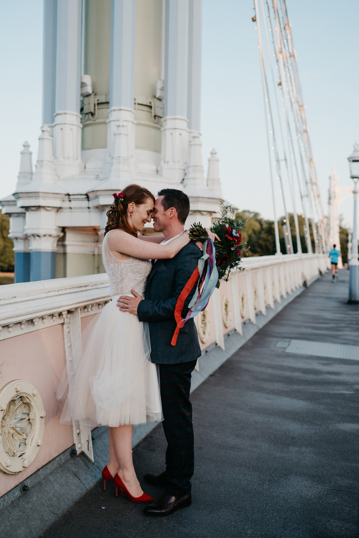 Short tulle skirt red shoes chic London family wedding Elaine Williams Photography 59