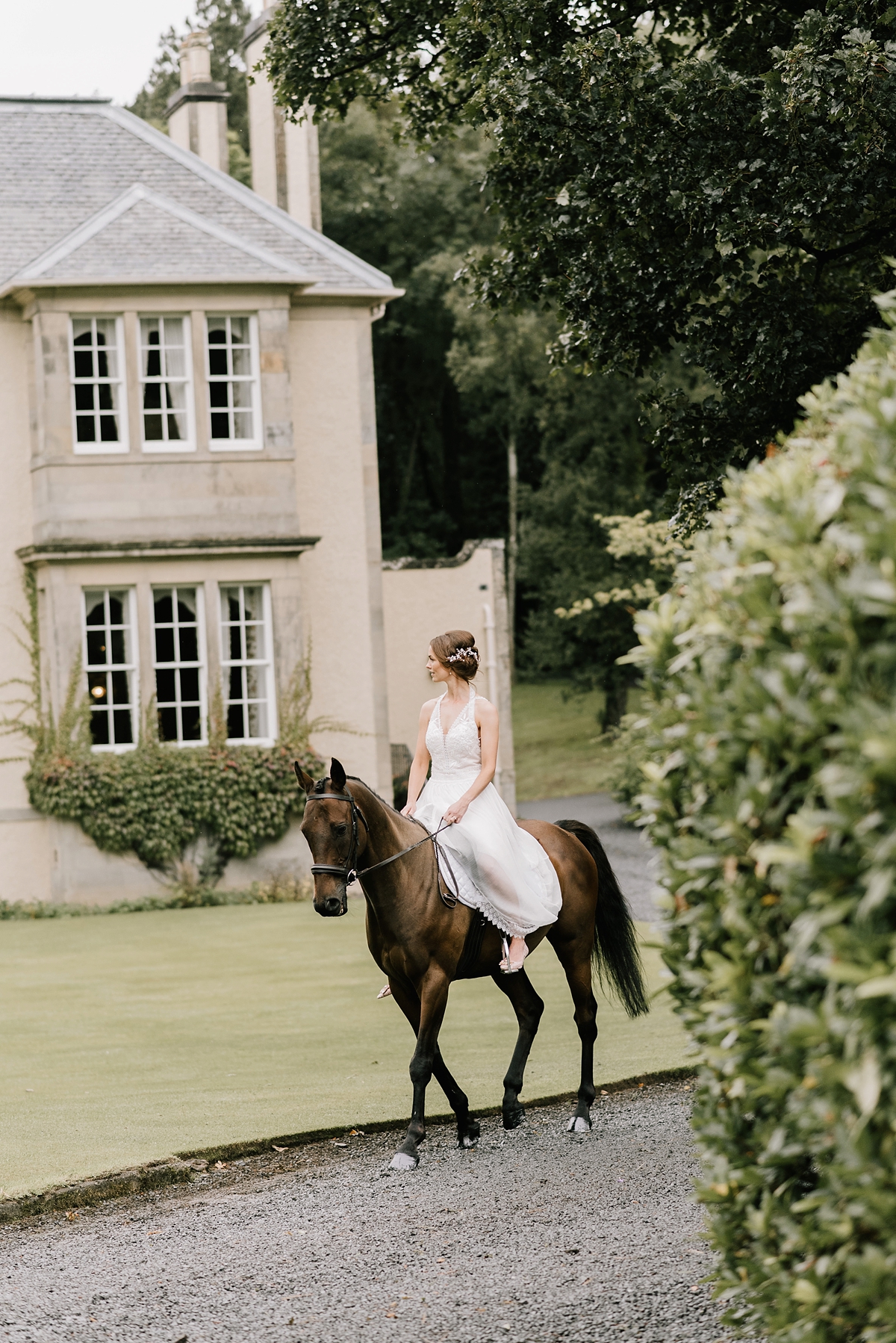 Bride arriving on horseback Hillhouse wedding Scotland 57