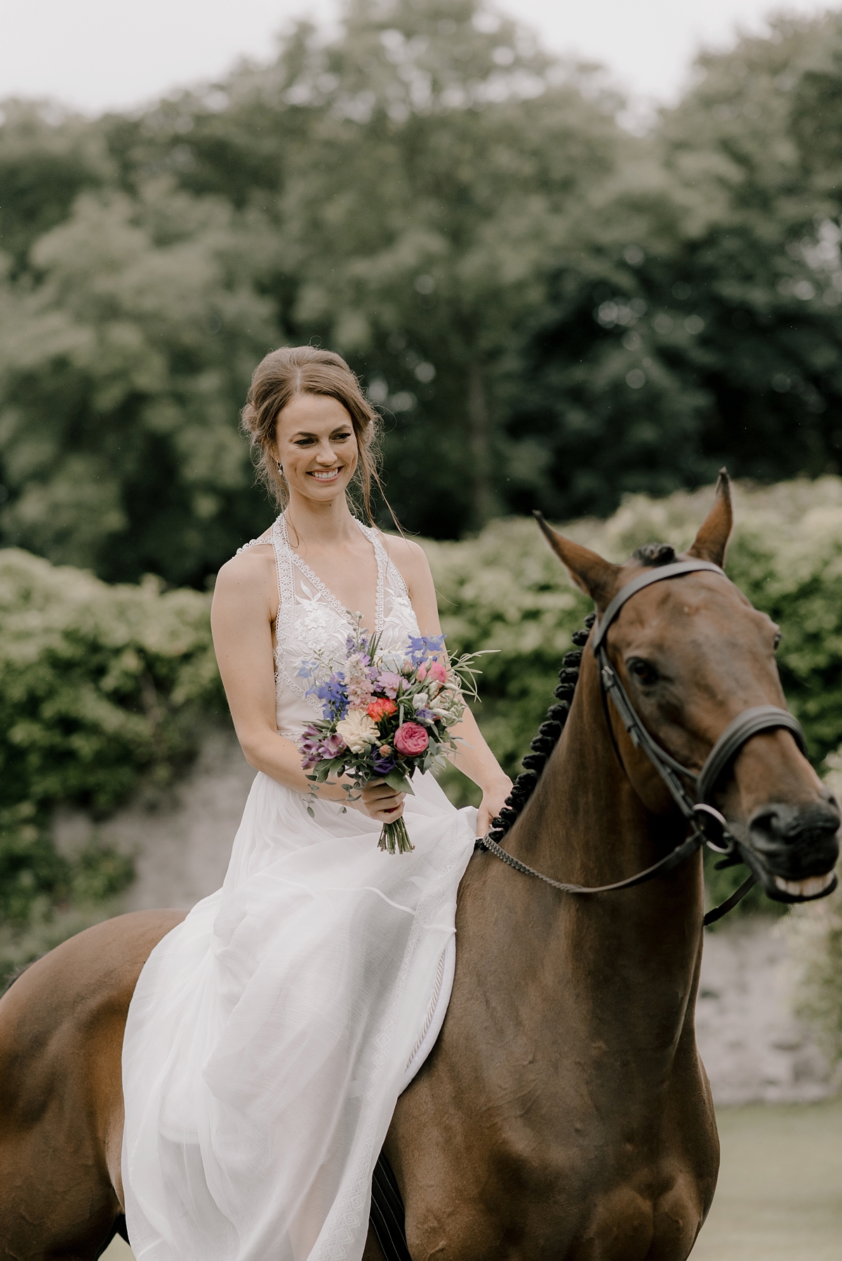 Bride arriving on horseback Hillhouse wedding Scotland 58