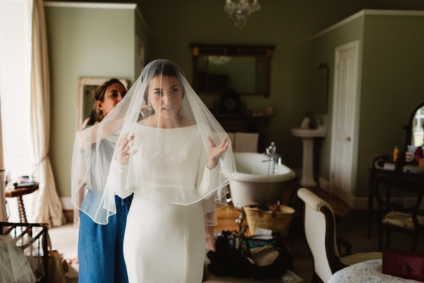 A Long Sleeved Justin Alexander Gown For a Tinder Couple + Their Black Tie Wedding at Pennard House