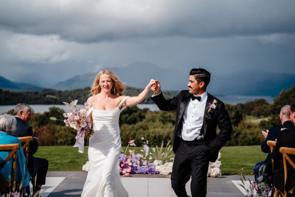 bride and groom just married with loch lomond views in the background