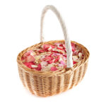 A confetti basket of pink and cream rose petals
