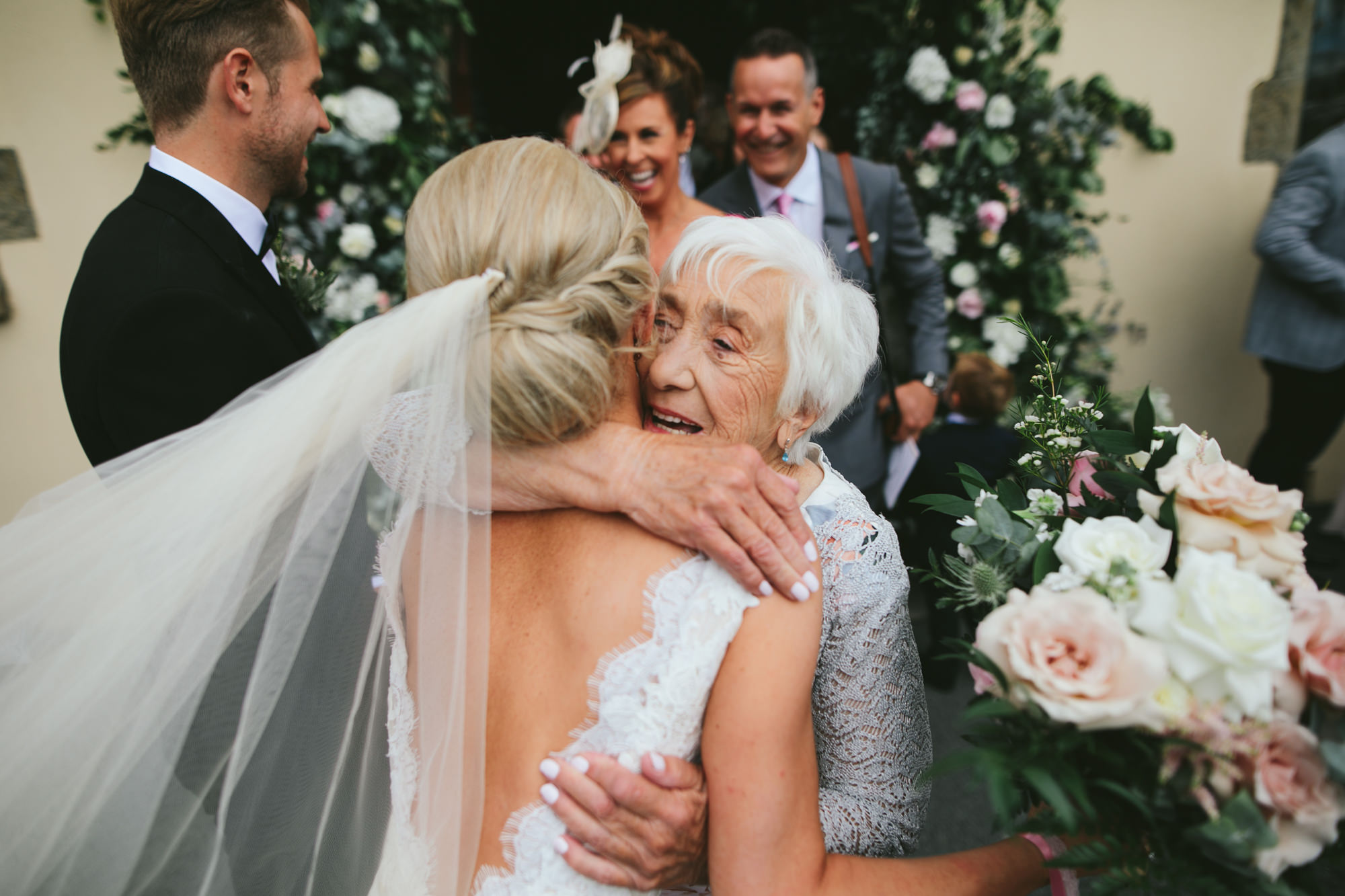 Bride hugging an elderly relative