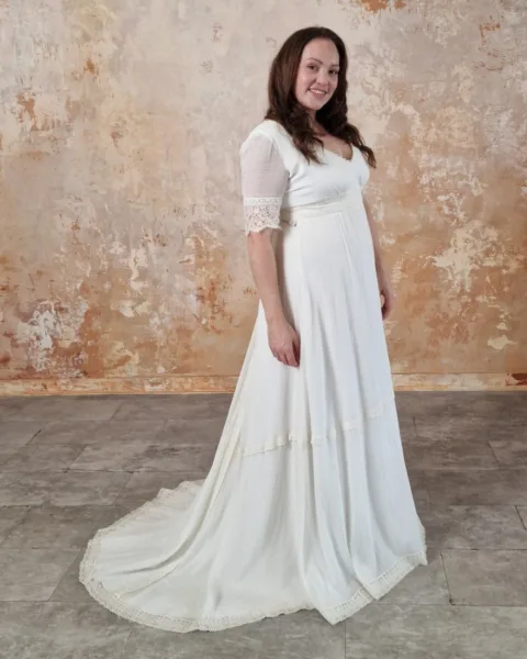 Model wearing a modern bohemian wedding dress.