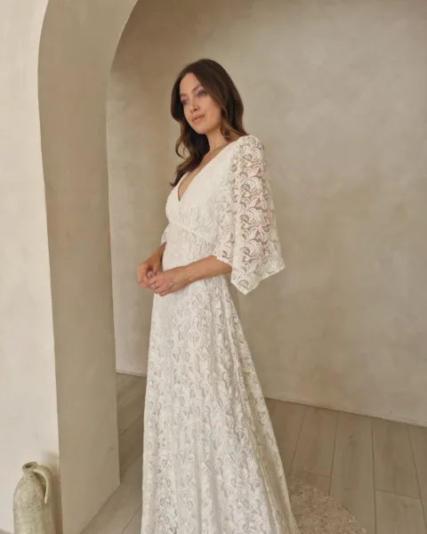 Model wearing a modern bohemian wedding dress.
