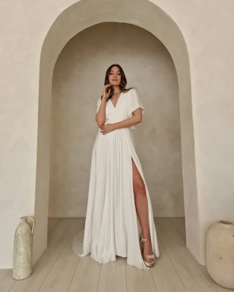 Model wearing a modern bohemian wedding dress.