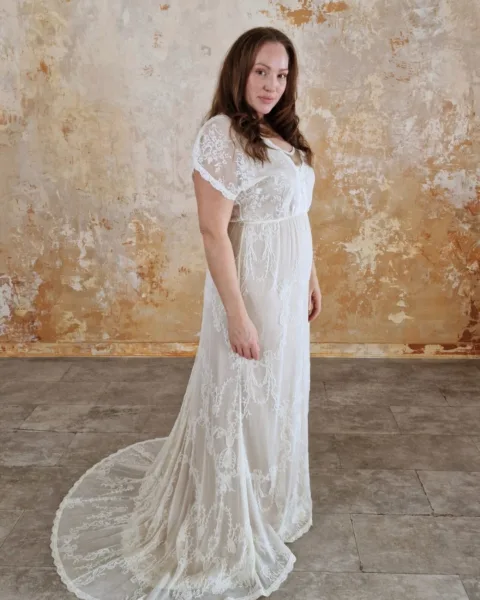 Model wearing a modern bohemian wedding dress.