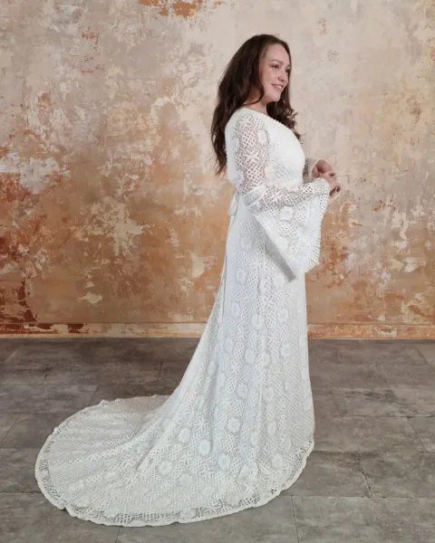Model wearing a modern bohemian wedding dress.