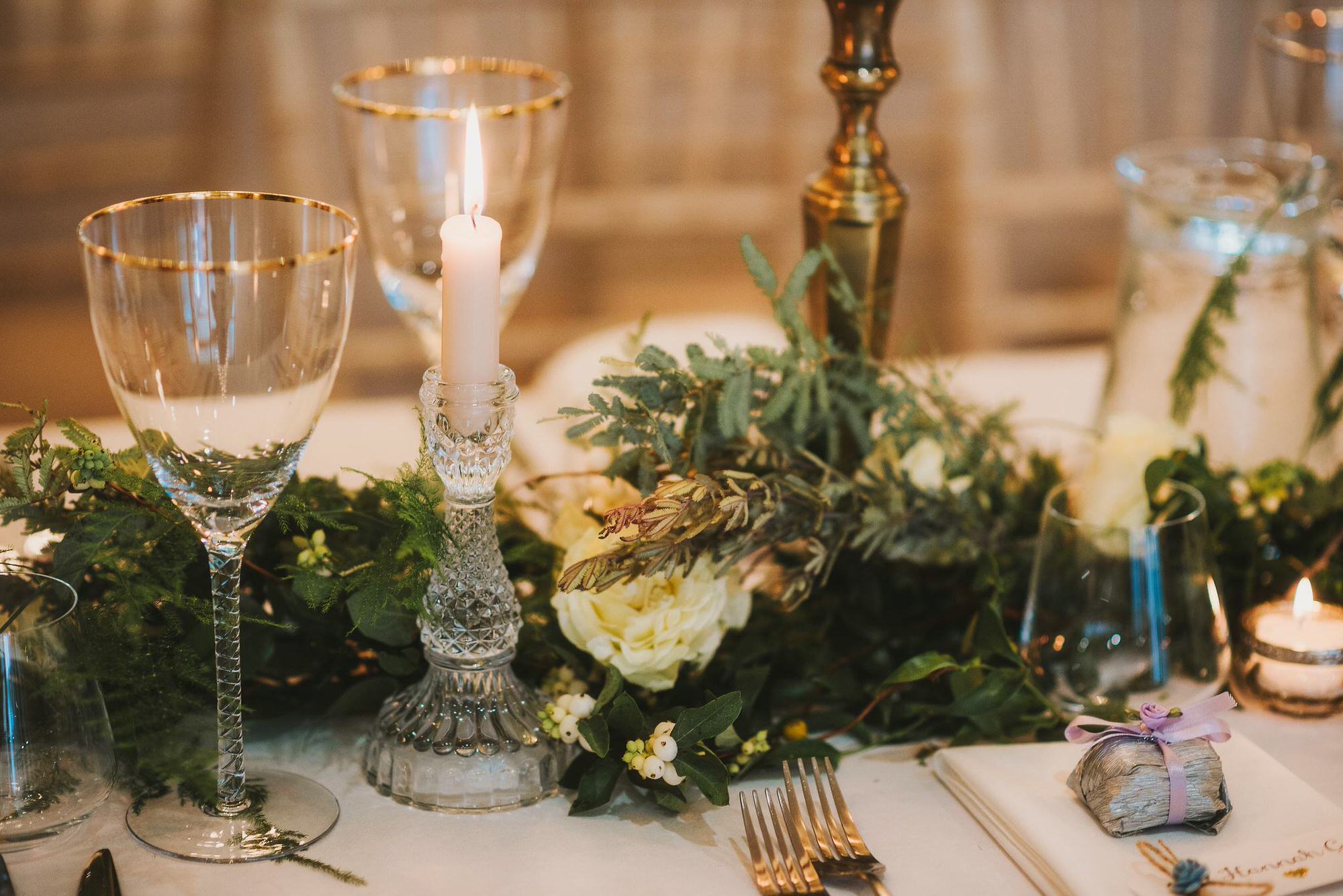 Green foliage and yellow rose wedding table decor
