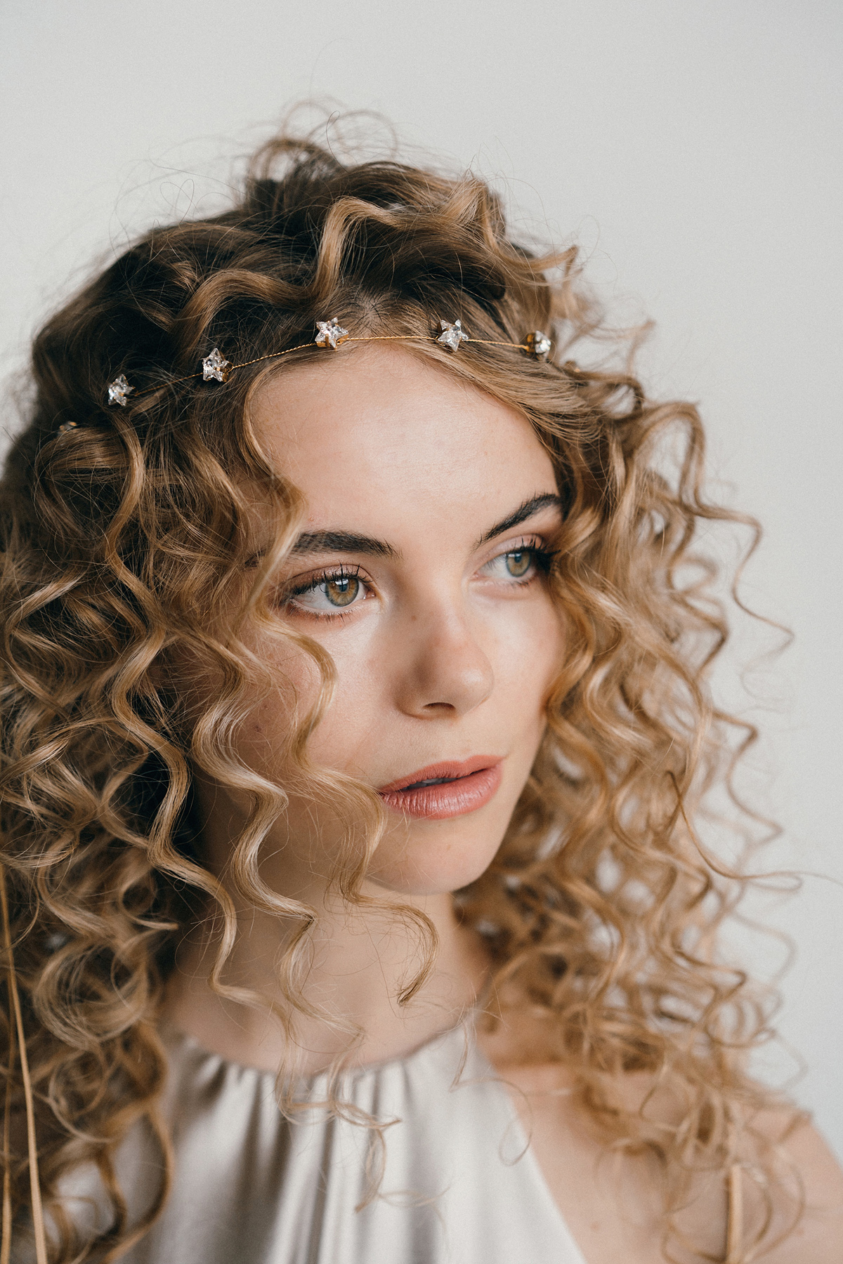 Curly haired bride Star gold Swarovski headband by debbiecarlisle.com £ - How To Style Wedding Hair Accessories With Curly Hair, Debbie Carlisle + Top Hair Care Tips for Curly Haired Brides