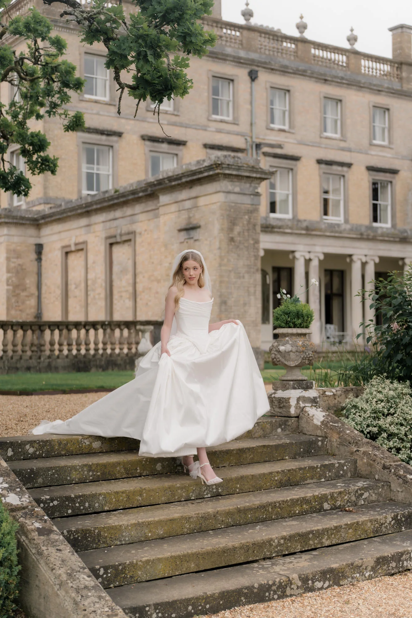 elegant satin bridal gown with cathedral veil.jpg - A Sustainable Summer Wedding at Hayne Devon with a Jane Bourvis Dress Kate Edmondson Bridal Couture