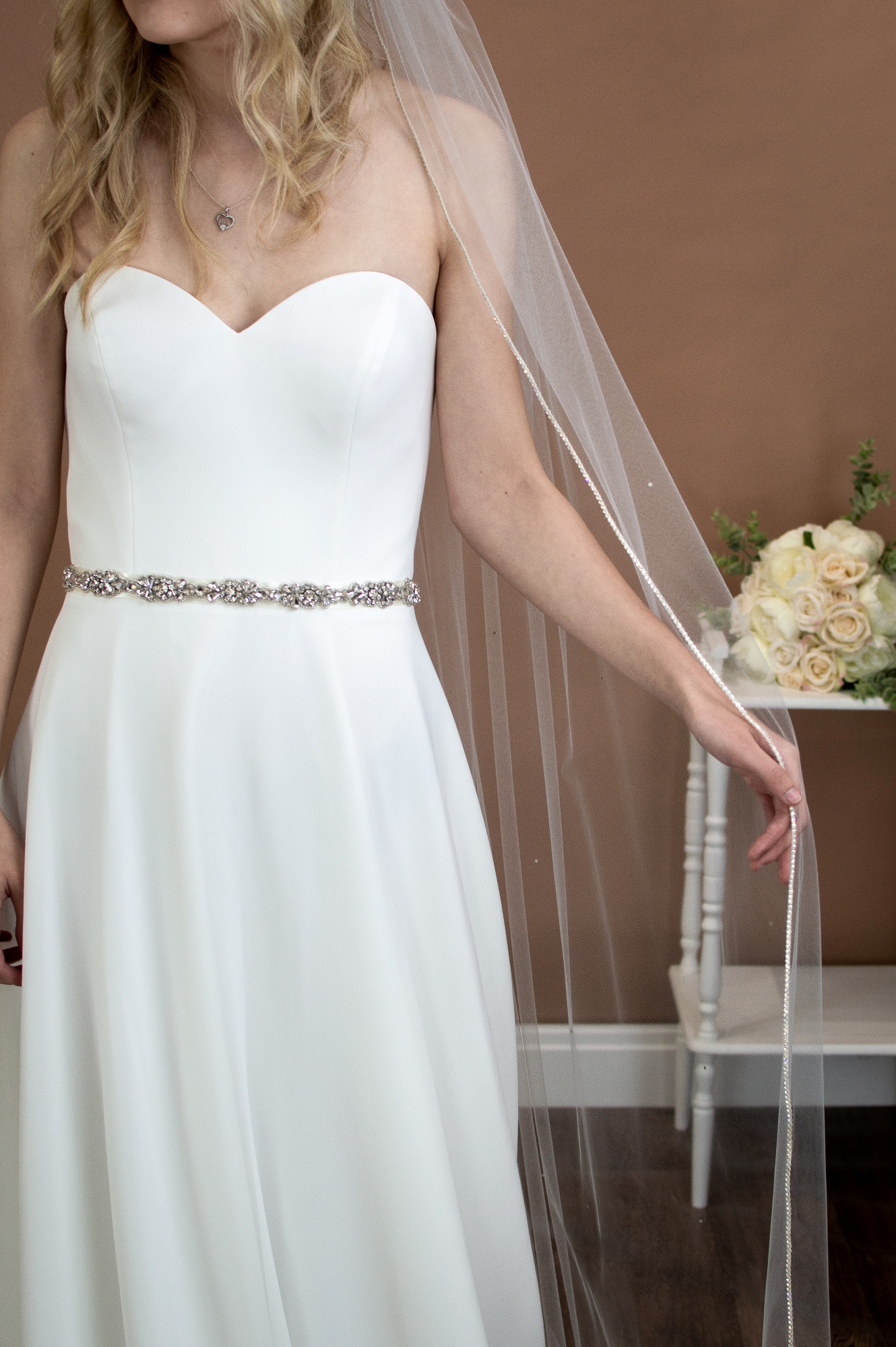 Alexandra one layer chapel veil with rhinestone edge and diamantes falling stars on bride front closeup