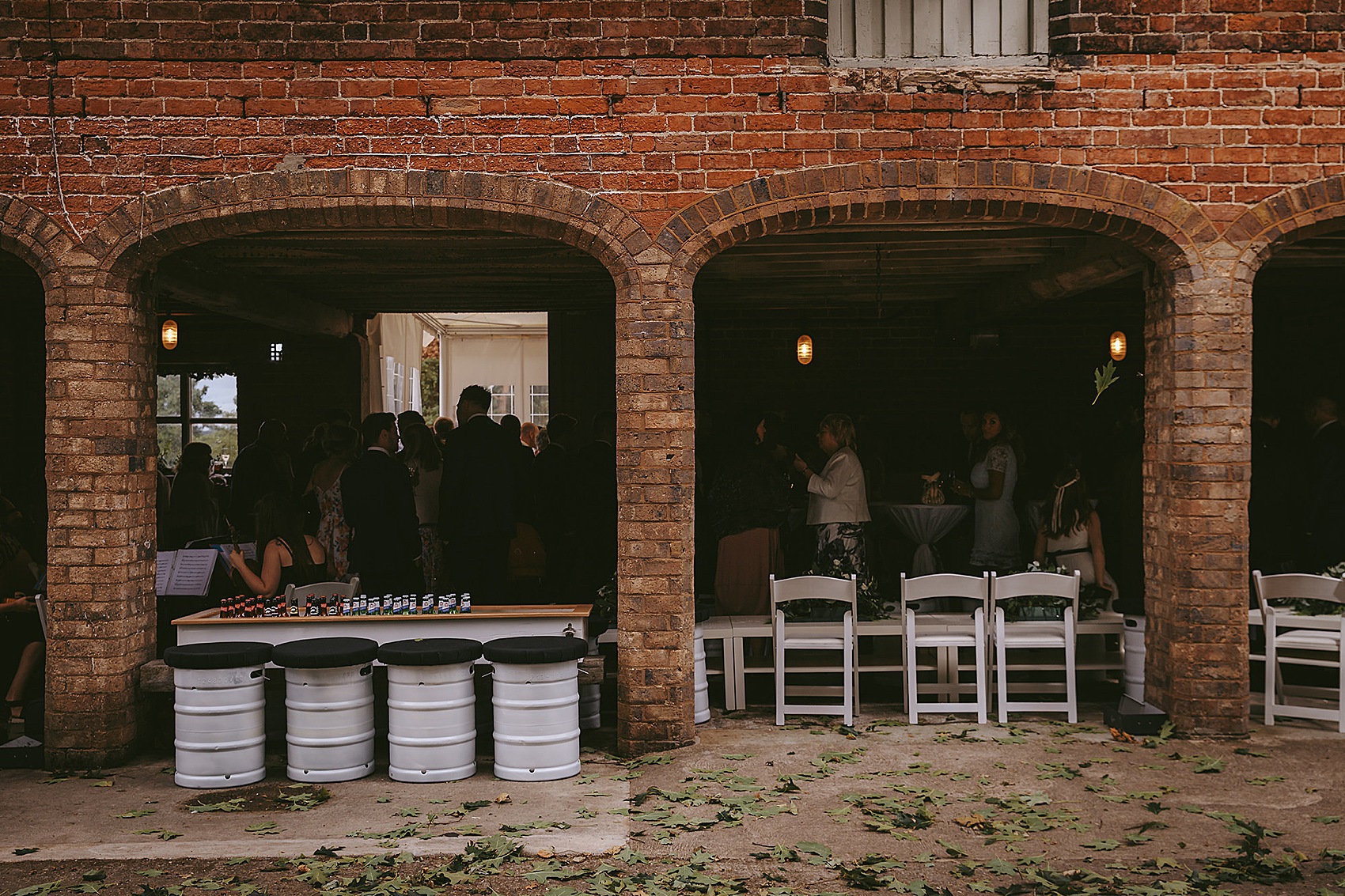 Elegant Caroline Castigliano bride  - A Caroline Castigliano Dress with a Lace Overskirt for a Contemporary Classic Black + Gold Barn Wedding