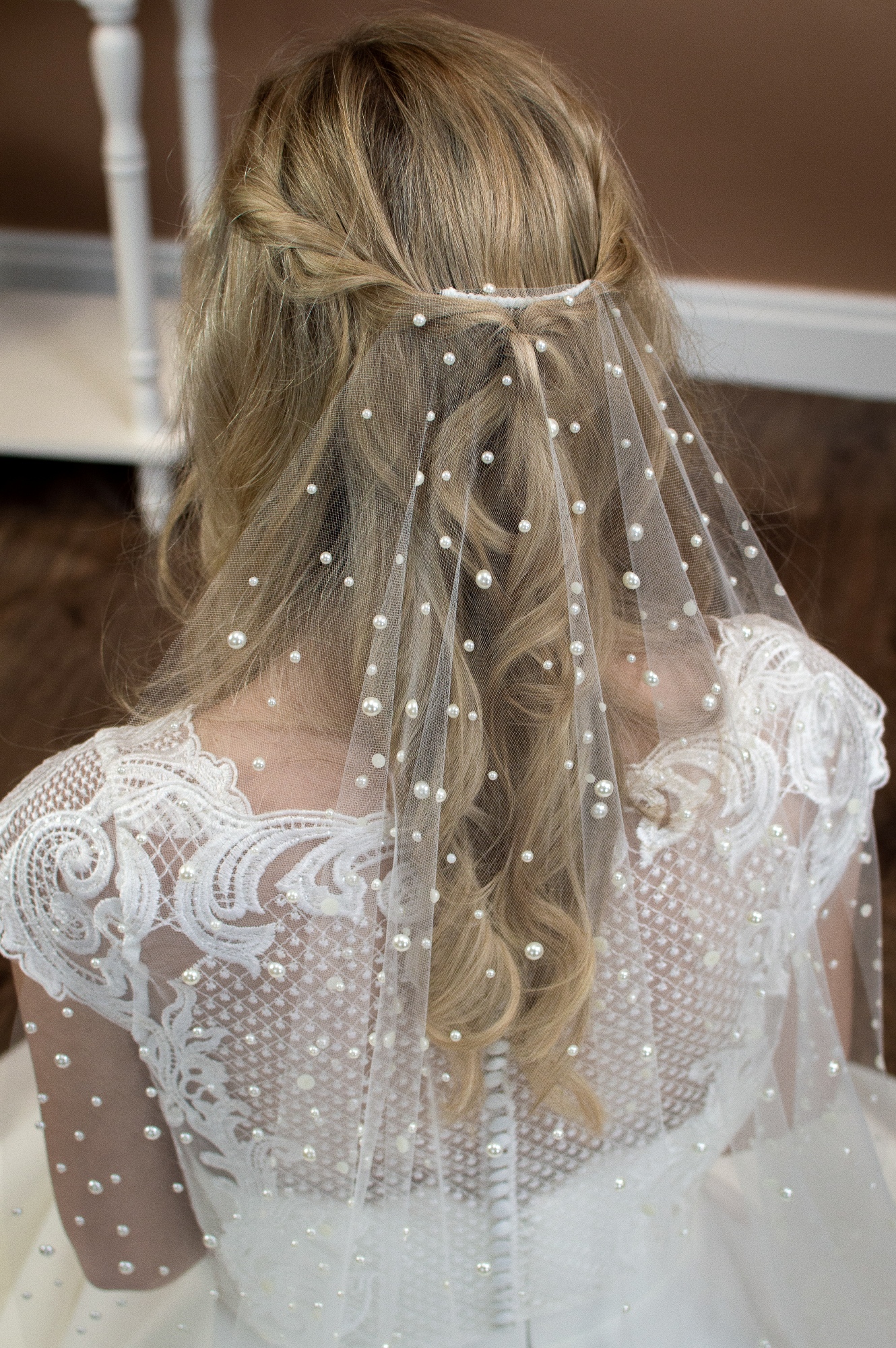 Violet Single layer barely there veil in fingertip length with a cut edge and mixed size pearls closeup  - The Wedding Veil Shop: Wedding Veil Lengths + Styles for Every Bride