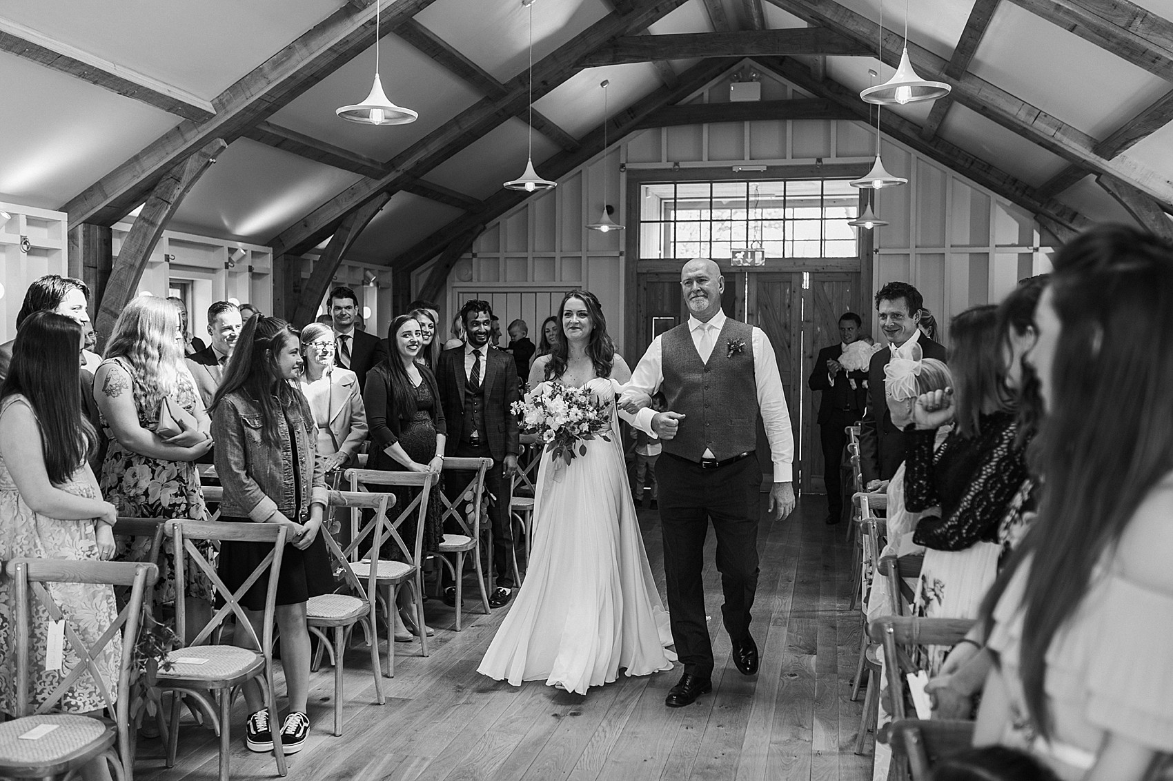 Bride with her father walking down the aisle