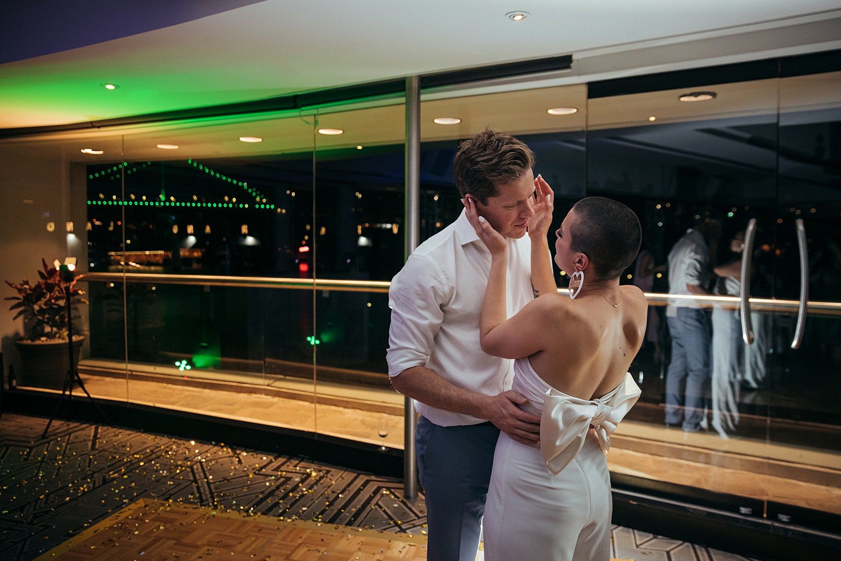 Bride in white tux oversizesd hat 35