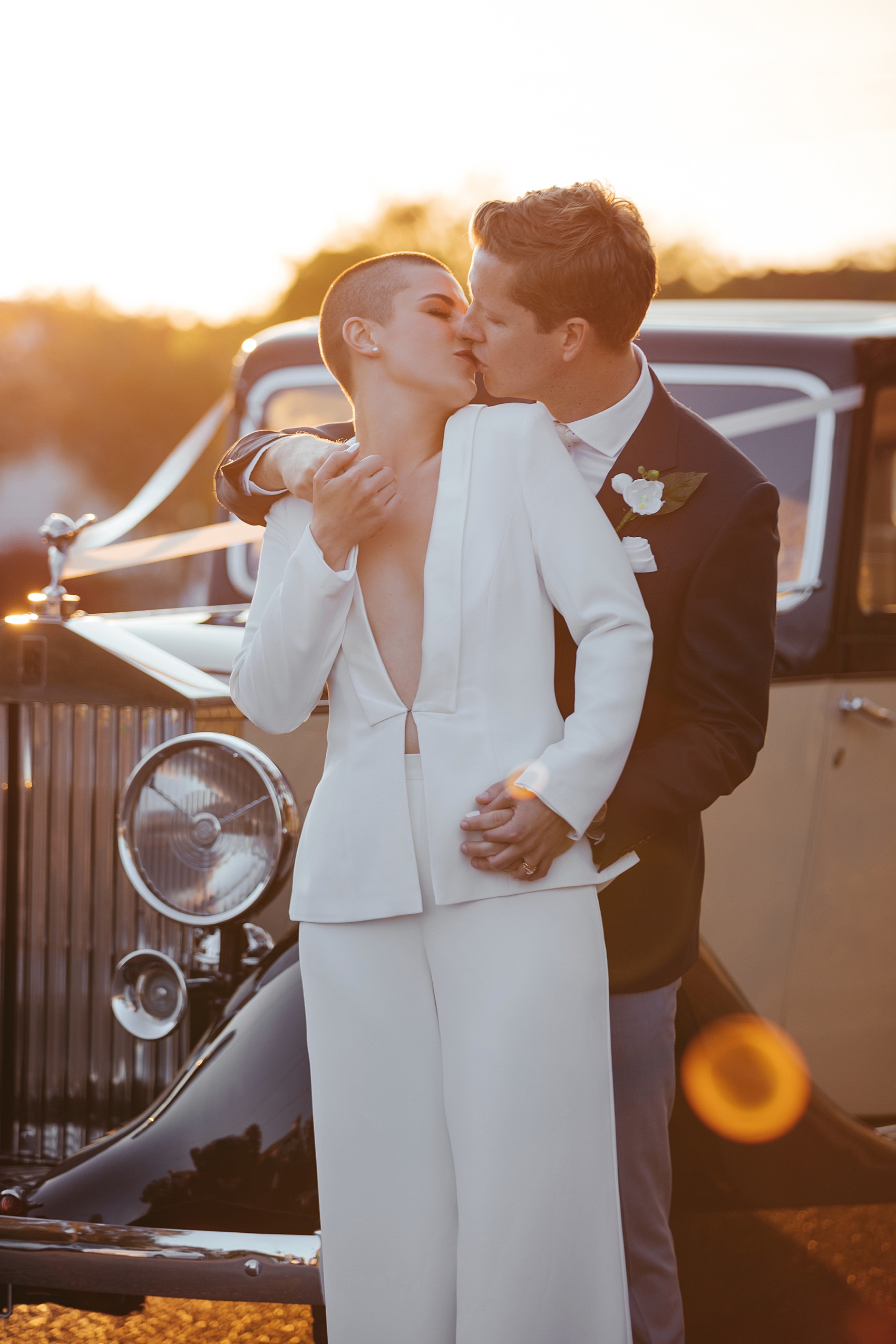 Bride in white tux oversizesd hat 53