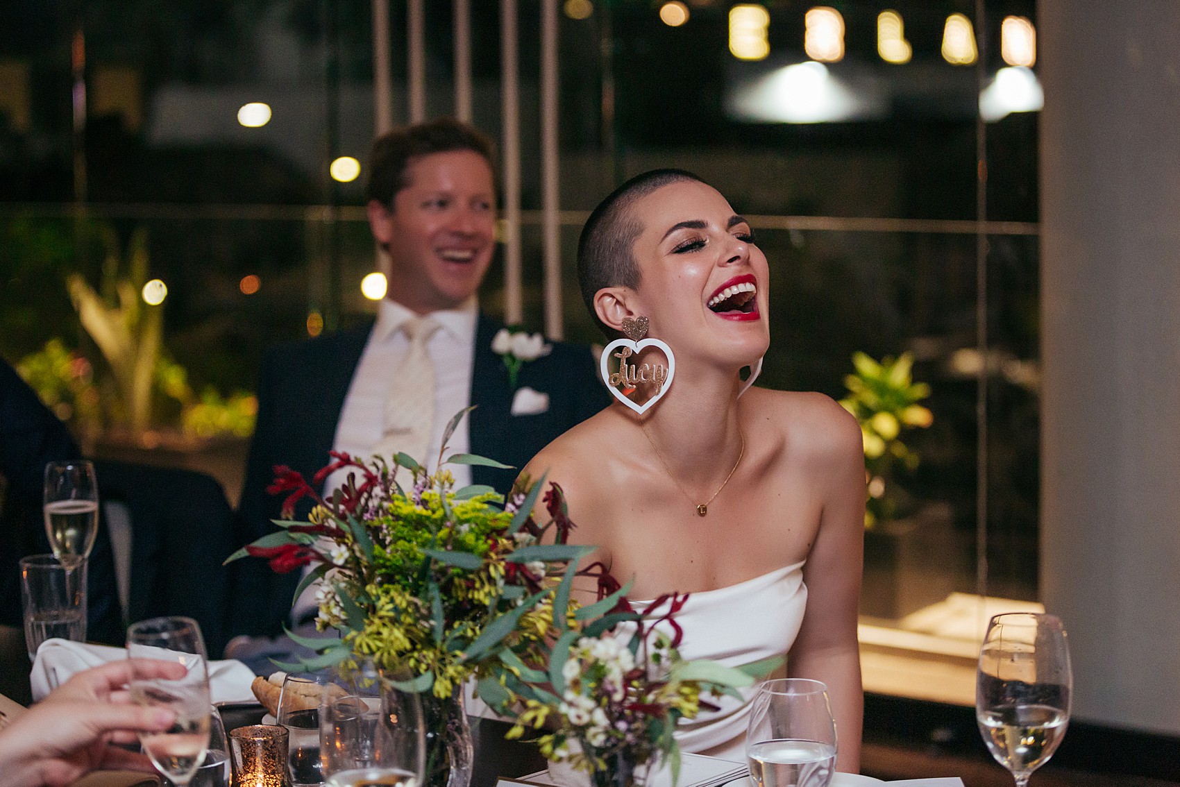 Bride in white tux oversizesd hat 60