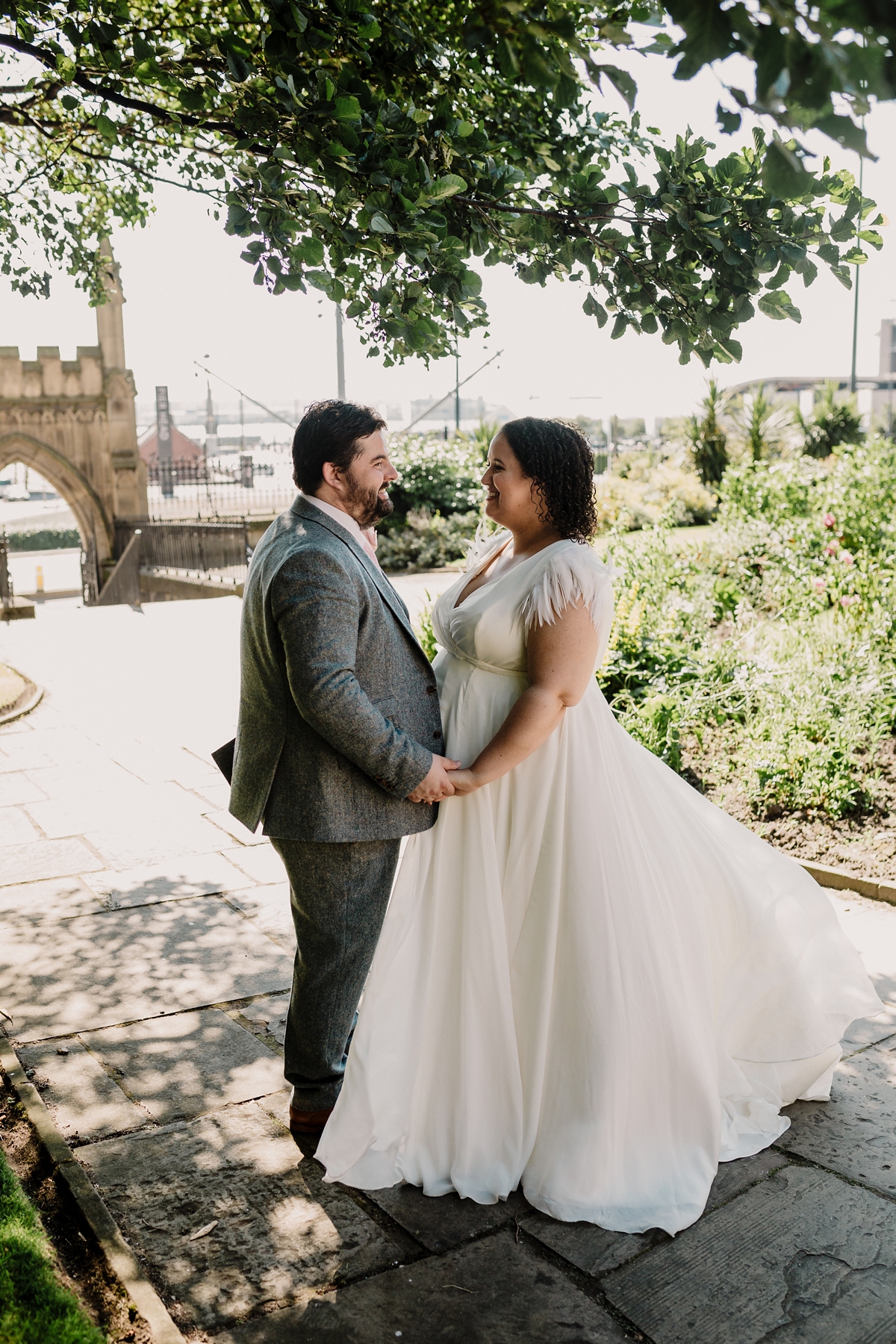 38 A pregnant bride wearing a feather cap sleeved Halfpenny London dress