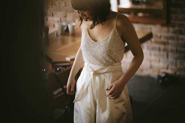 A River Cottage Wedding in Devon with a Bride in a Sequin Andrea Hawkes Top + Wide Leg Silk Halfpenny London Trousers