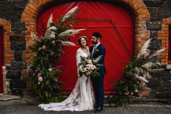A Backless, Bohemian, Rue de Seine Tasselled Dress for an Autumn Barn Wedding at Larchfield Hall in Northern Ireland