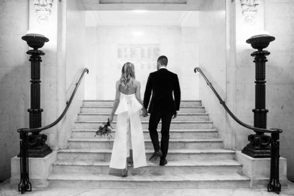 An ASOS Bridal Jumpsuit with Oversized Bow and a Groom in Green Velvet Tux for a Stylish & Intimate London Wedding at Old Marylebone Town Hall