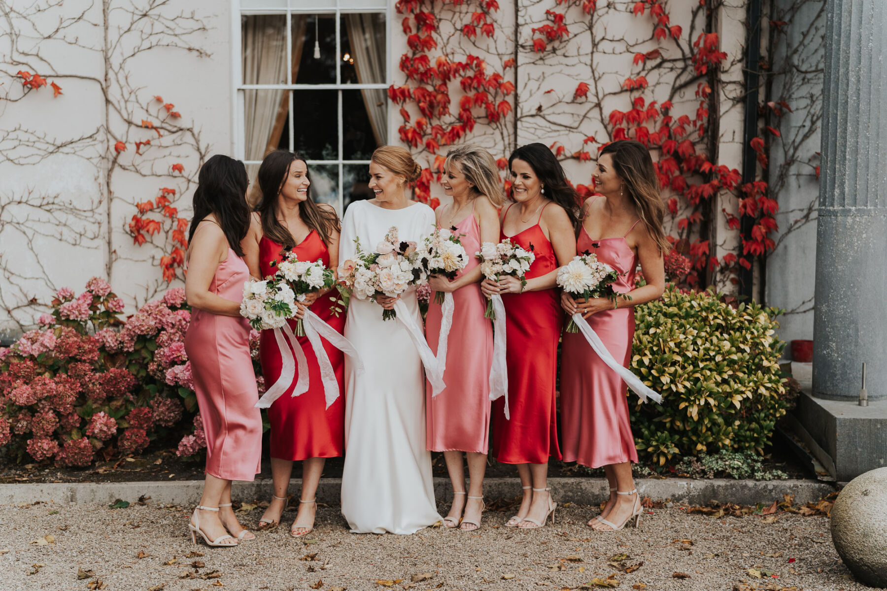 Bridemaids in pink red slip dresses