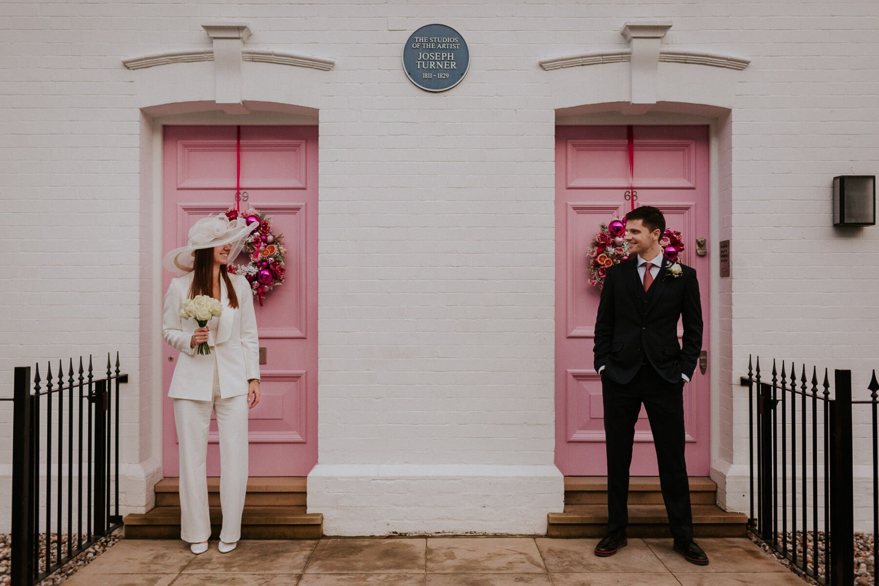 A Bianca Jagger Inspired Hat and Jumpsuit for a Lockdown Micro Wedding in London at Chelsea Old Town Hall 14 London pink doors micro wedding