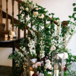 Floral staircase at Pennard House wedding venue in Somerset