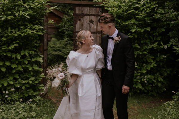 A Jesus Peiro Gown With Detachable Puff Sleeves for a Millbridge Court Garden Wedding