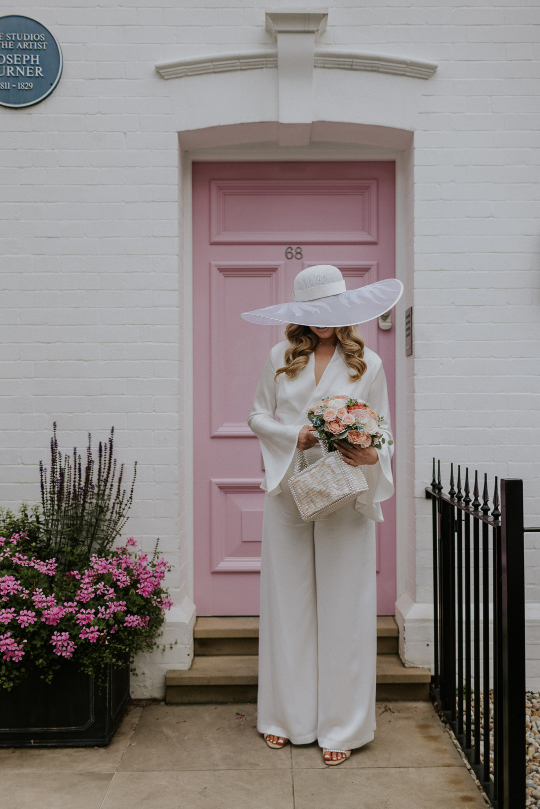 30 Bride in a wide brim hat Chelsea wdding