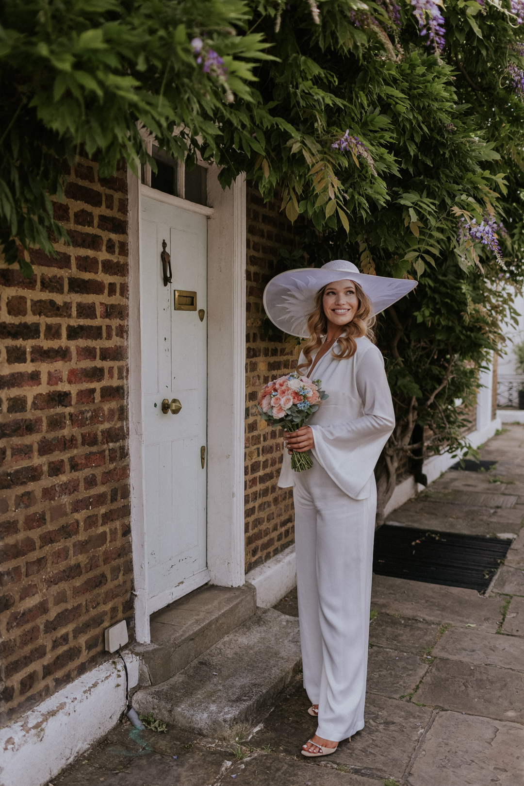 42 Bride in a wide brim hat Chelsea wdding