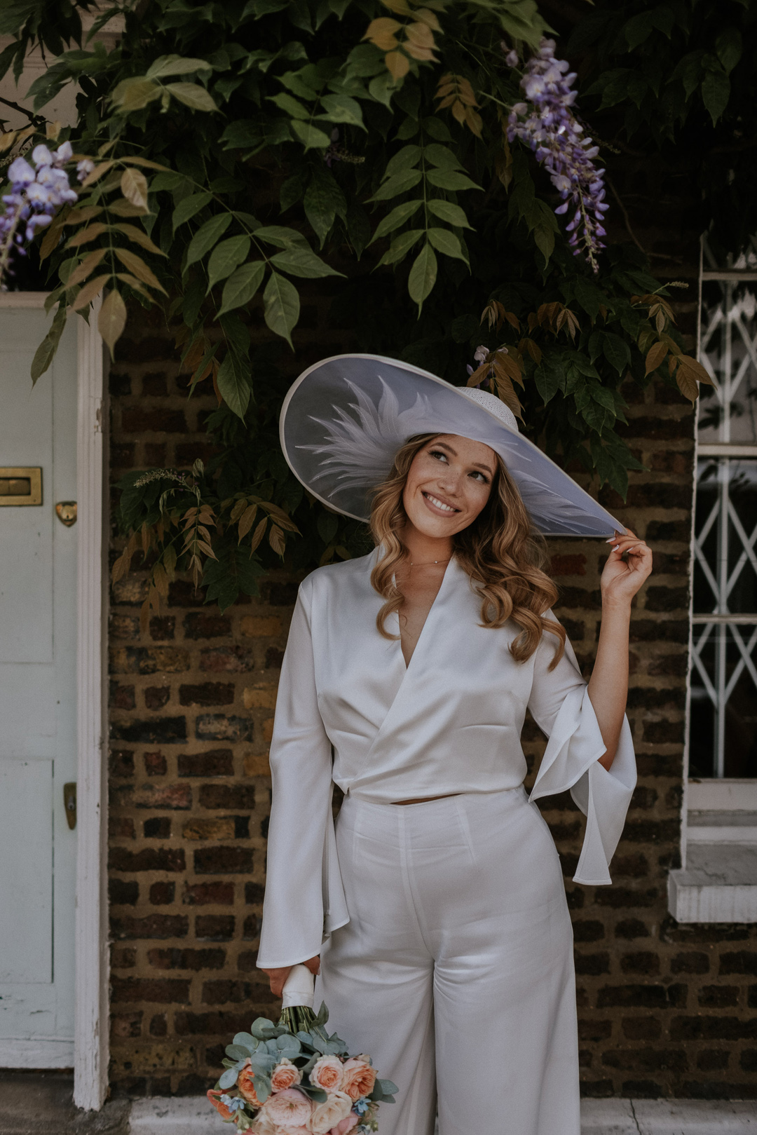 44 Bride in a wide brim hat Chelsea wdding