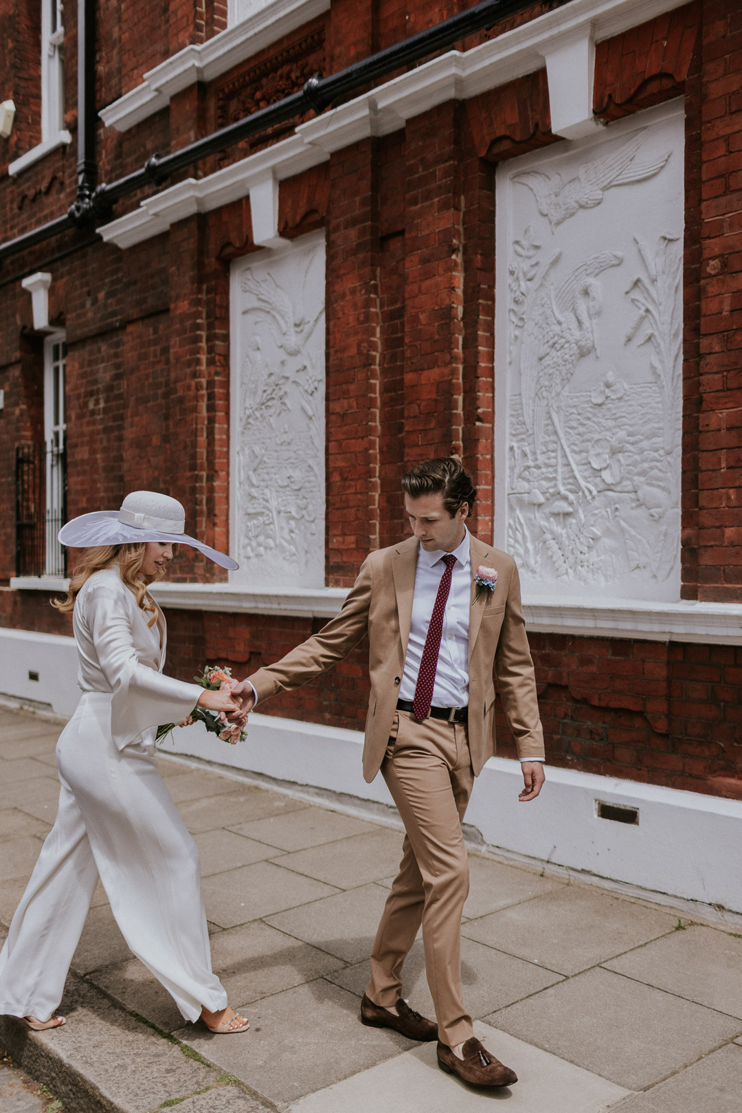 47 Bride in a wide brim hat Chelsea wdding