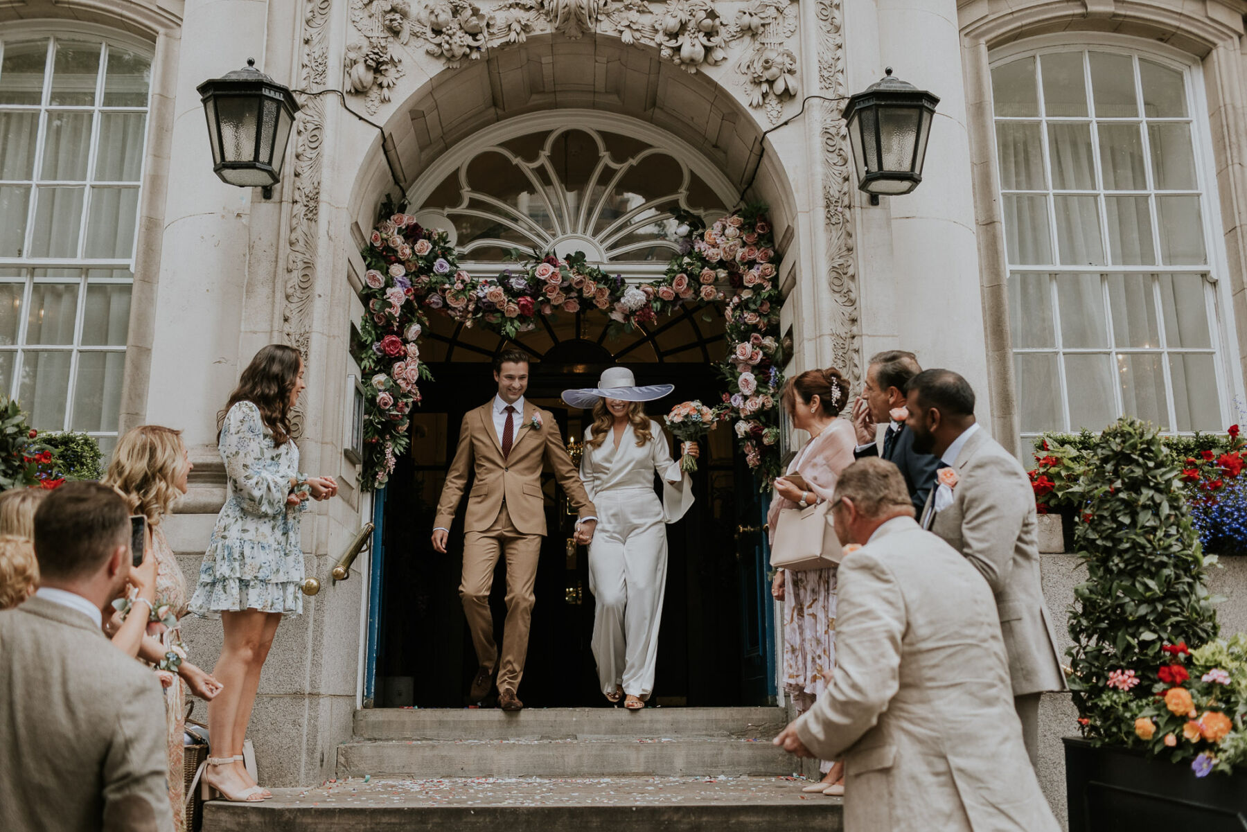 A Bianca Jagger Inspired Bride in an Awon Golding Wide Brim Hat, and her Intimate Chelsea Old Town Hall Wedding Love My Dress, UK Wedding Blog, Podcast, Directory and Shop picture photo