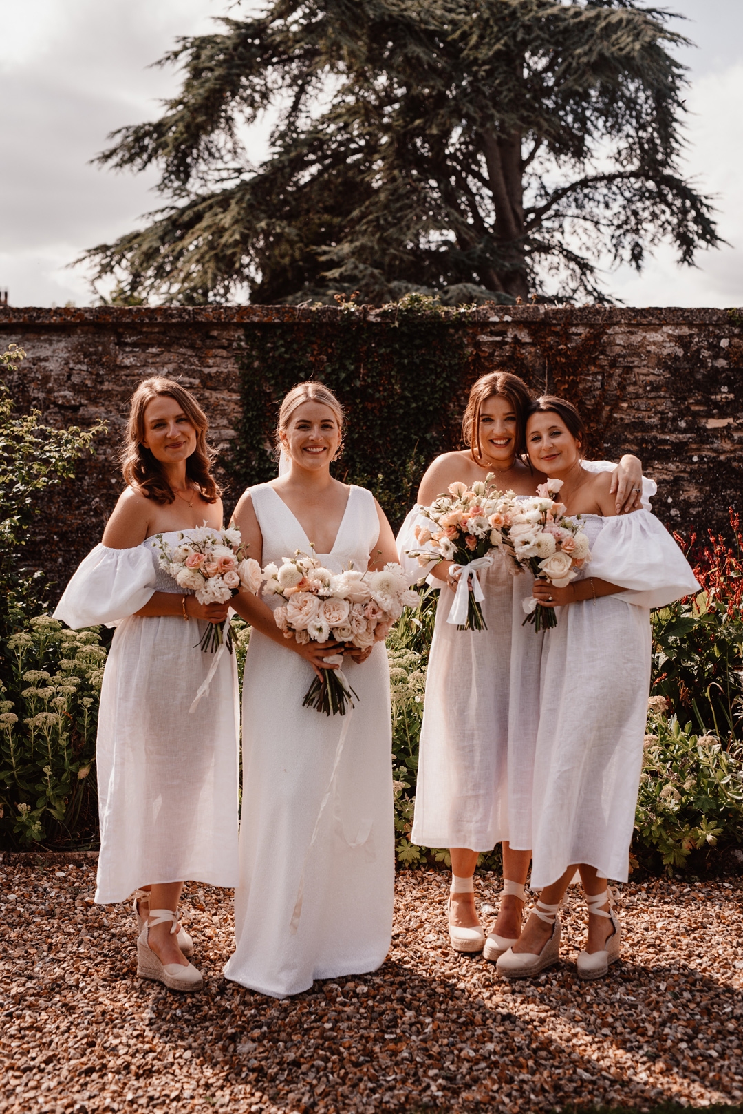 The Own Studio wedding dress. Bridesmaids all in white.