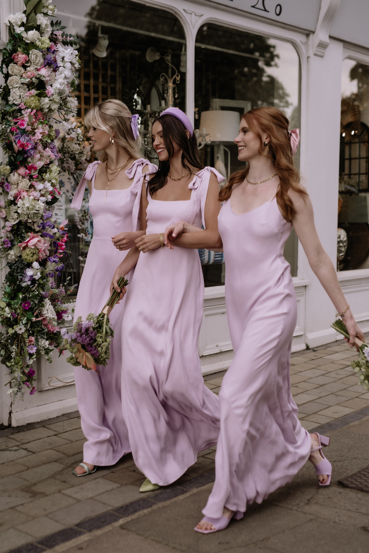 Bridesmaid in long, lilac dresses by Maids to Measure