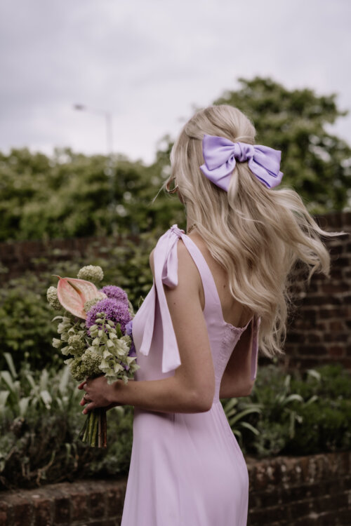 Lilac bridesmaids dress. Lilac hair bow. Maids to Measure Bridesmaids Dresses.