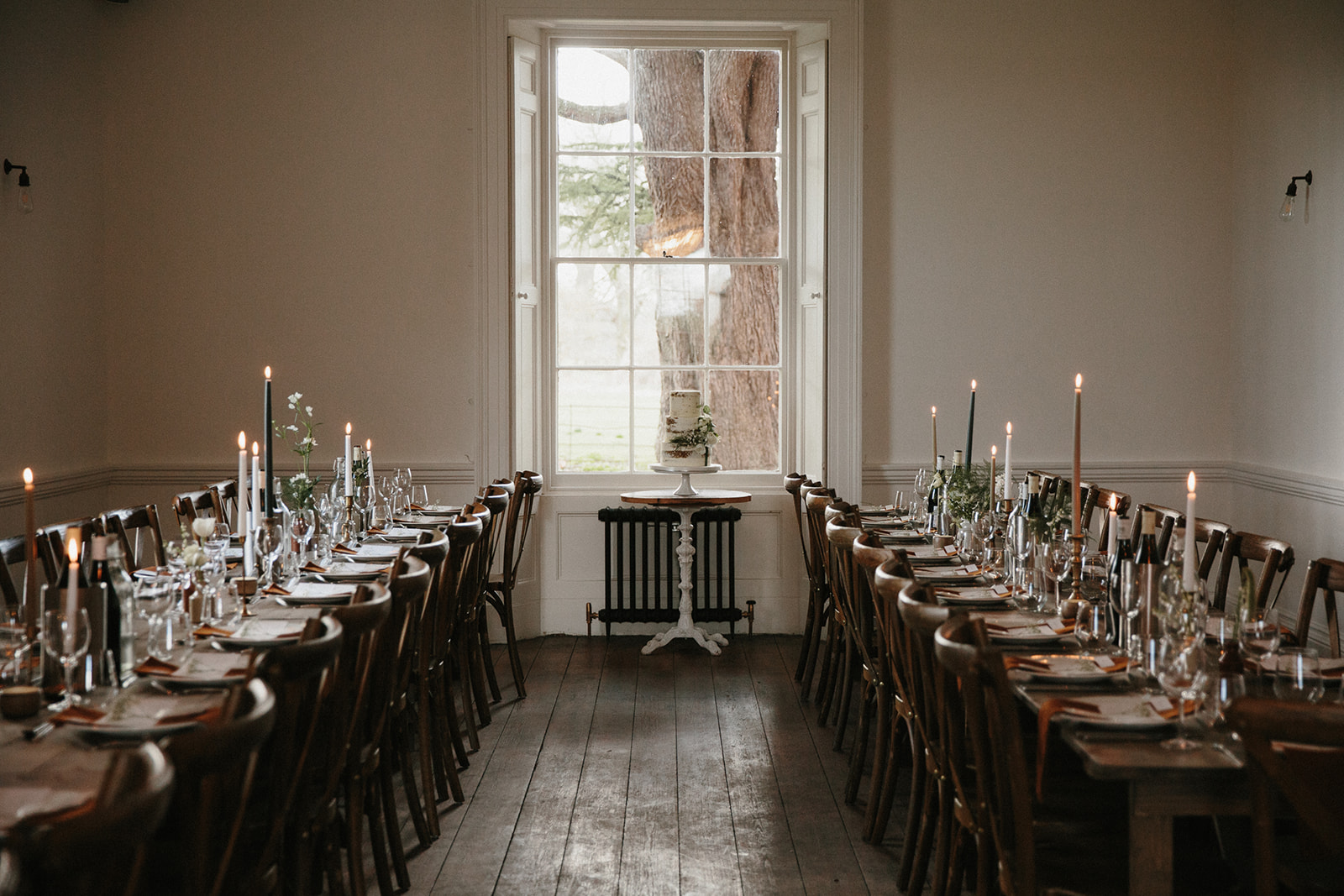 Crossback chairs + long wooden tables at Aswarby Rectory wedding venue