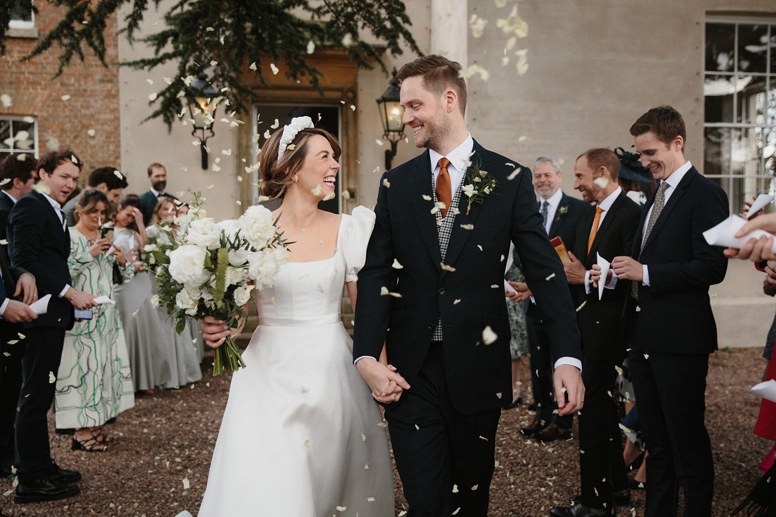 Confetti shot at Aswarby Rectory. Bride in puff sleeve Sassi Holford dress.