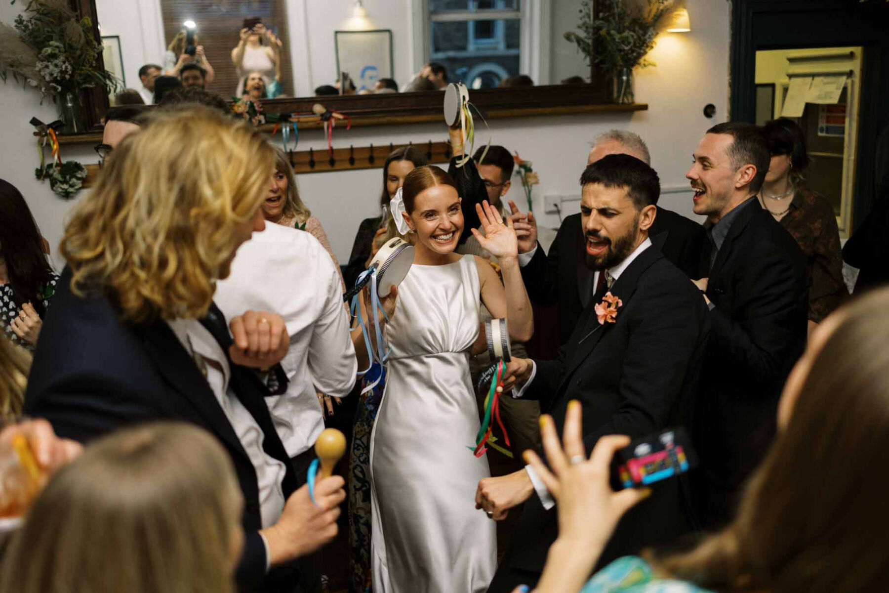 Bride with tambourine festival wedding London pub 1