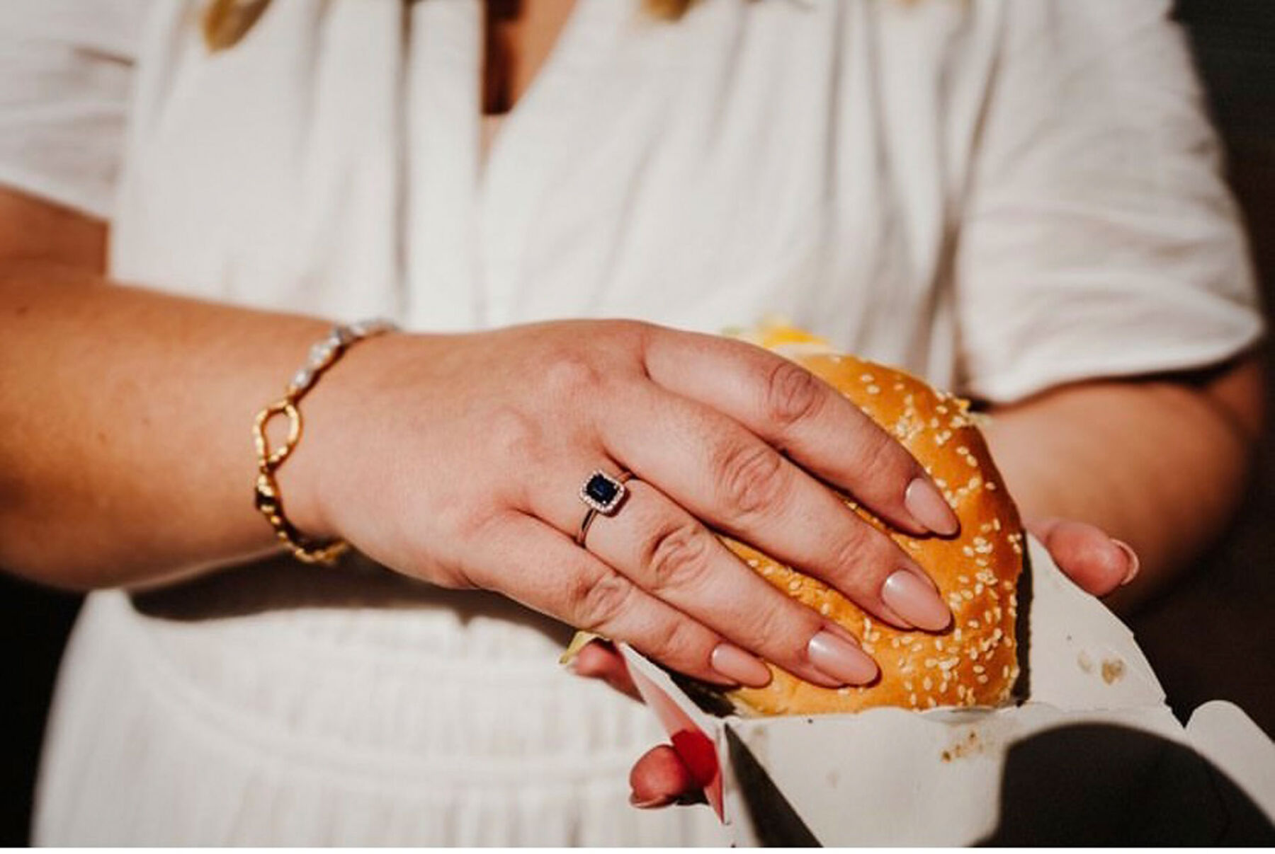 Bride holding a Burger. Patchwork sustainable + alternative wedding gift registry.