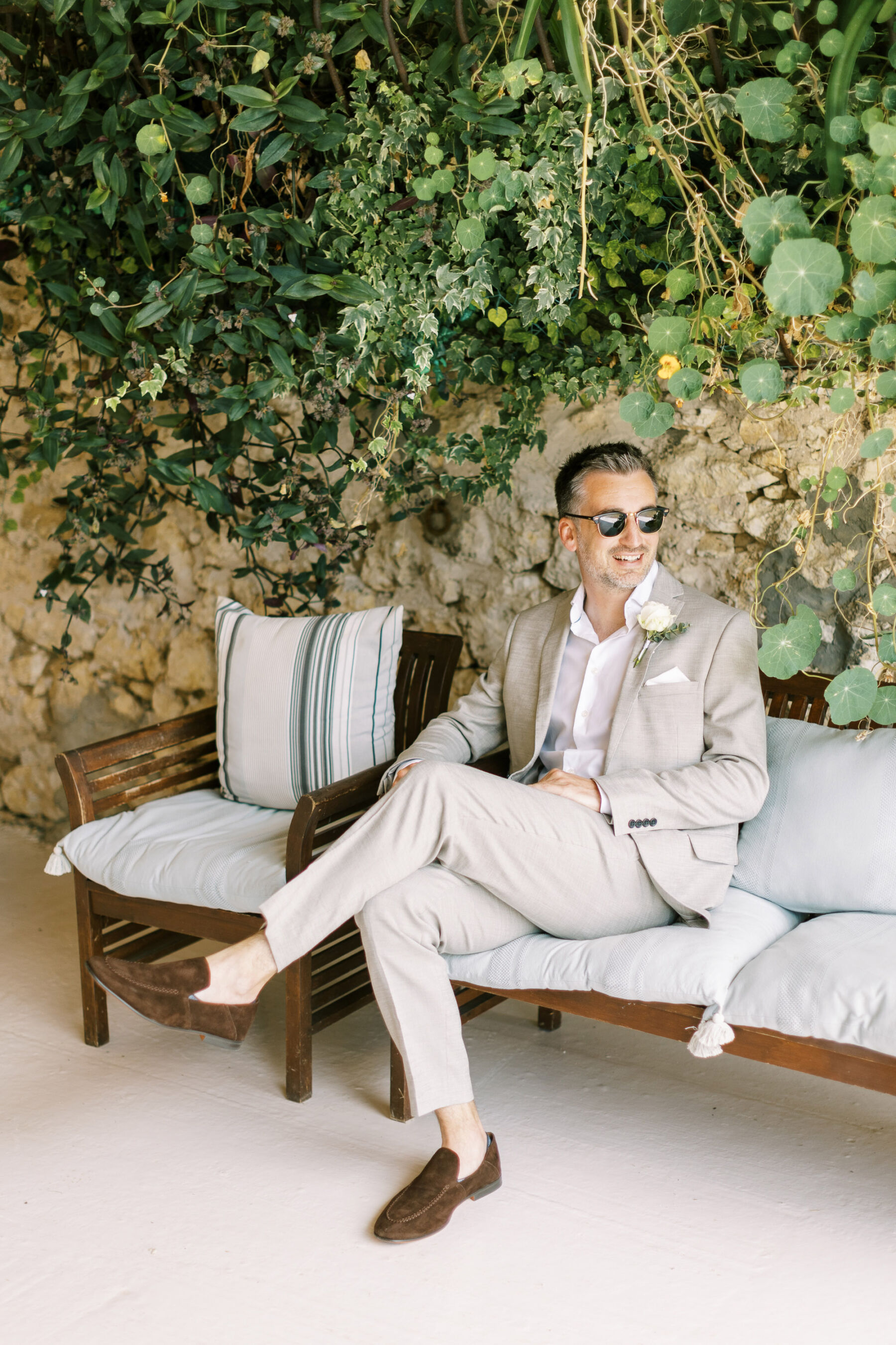 Groom in pale M&S suit and brown suede laofers